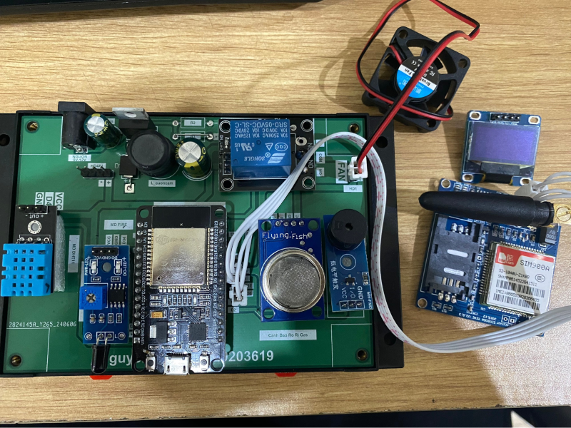 A green circuit board with wires and wires

Description automatically generated